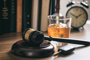 gavel and liquor in a table