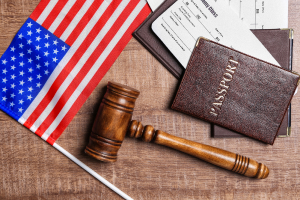 passport, gavel and American flag on a table